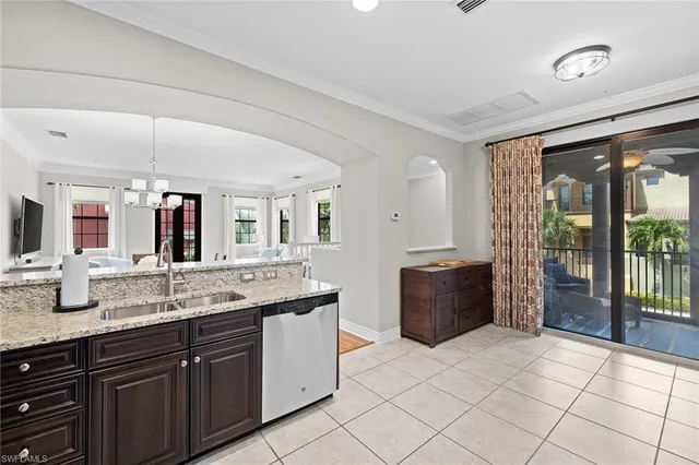 a spacious bathroom with a granite countertop sink a toilet a mirror and vanity