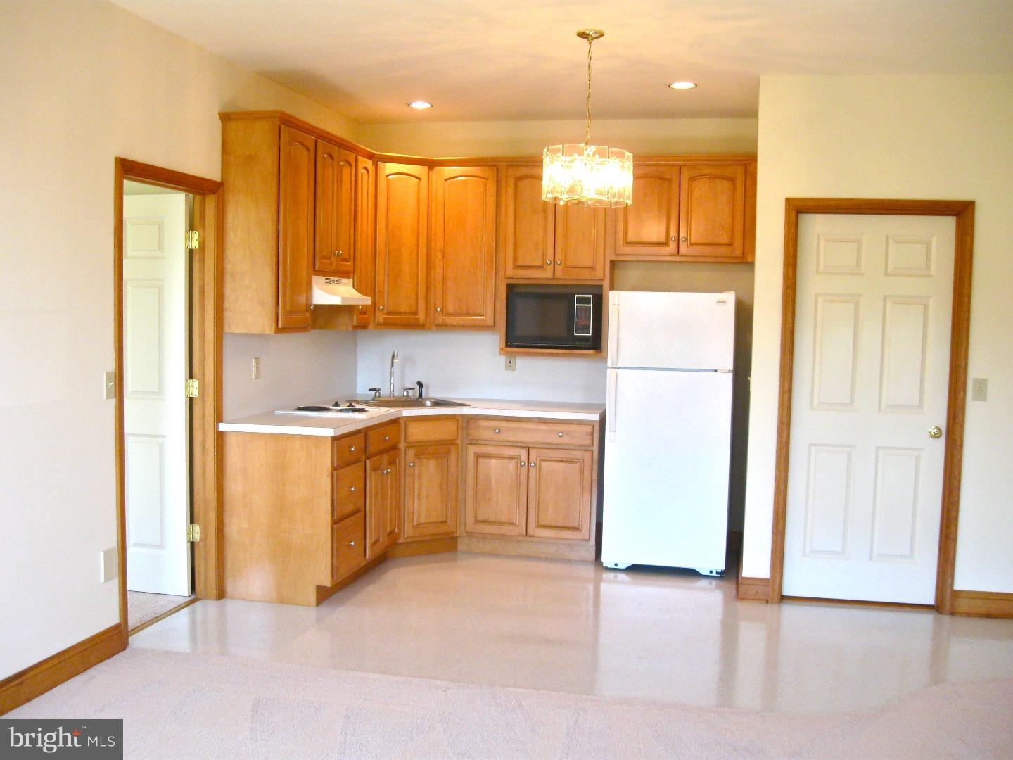 1011 Bucks Road Perkasie, PA 18944 - Photo 18 of 25 a kitchen with a refrigerator sink and cabinets