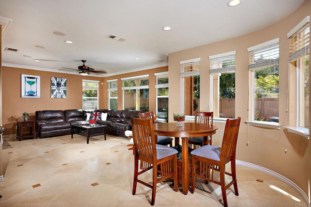 962 Baylor Drive San Marcos, CA 92078 - Photo 11 of 40 a dining room with furniture and wooden floor