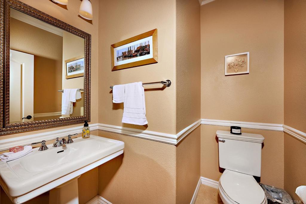 962 Baylor Drive San Marcos, CA 92078 - Photo 14 of 40 a bathroom with a sink mirror vanity and toilet