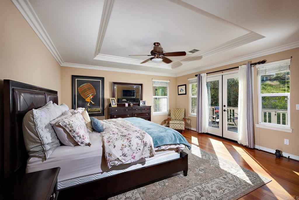 962 Baylor Drive San Marcos, CA 92078 - Photo 17 of 40 a bedroom with a large bed and a window