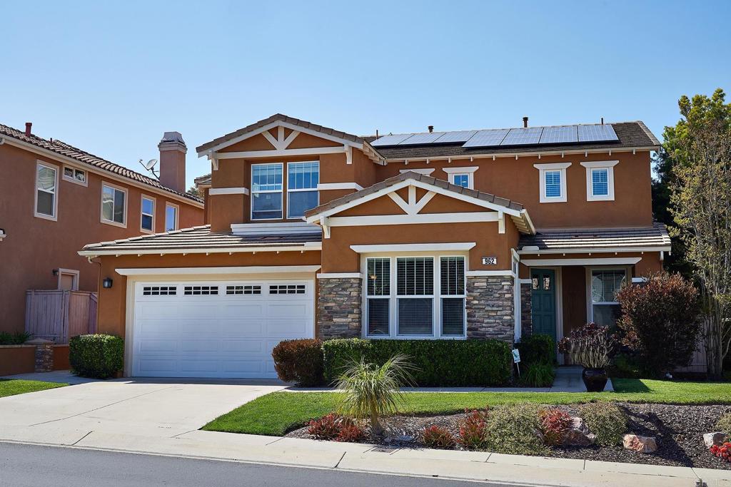 962 Baylor Drive San Marcos, CA 92078 - Photo 2 of 40 a front view of a house with a yard and garage