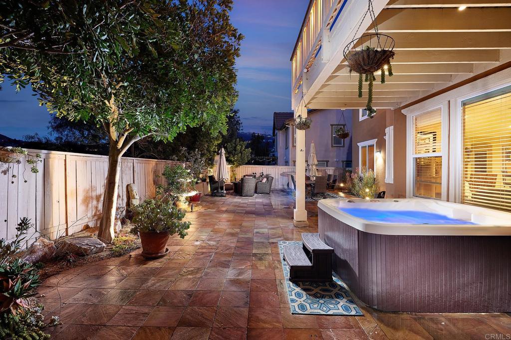 962 Baylor Drive San Marcos, CA 92078 - Photo 38 of 40 a view of a patio with couches table and chairs and potted plants