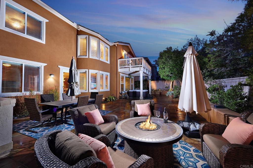 962 Baylor Drive San Marcos, CA 92078 - Photo 39 of 40 a view of a patio with couches table and chairs and wooden fence