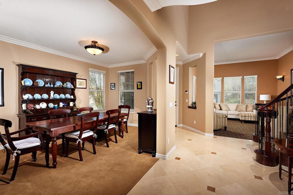 962 Baylor Drive San Marcos, CA 92078 - Photo 6 of 40 a living room with furniture a chandelier and a flat screen tv