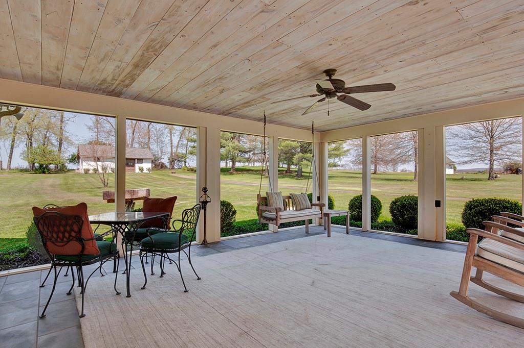 185 Barron Road Ligonier, PA 15658 - Photo 15 of 47 Large screened-in porch overlooks the private backyard