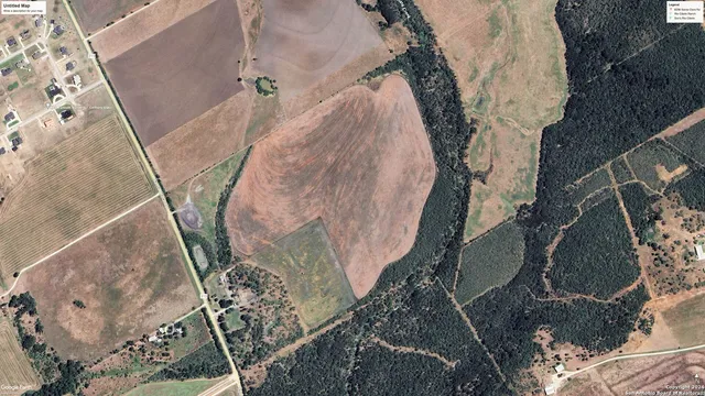 a view of a lake with houses in the back