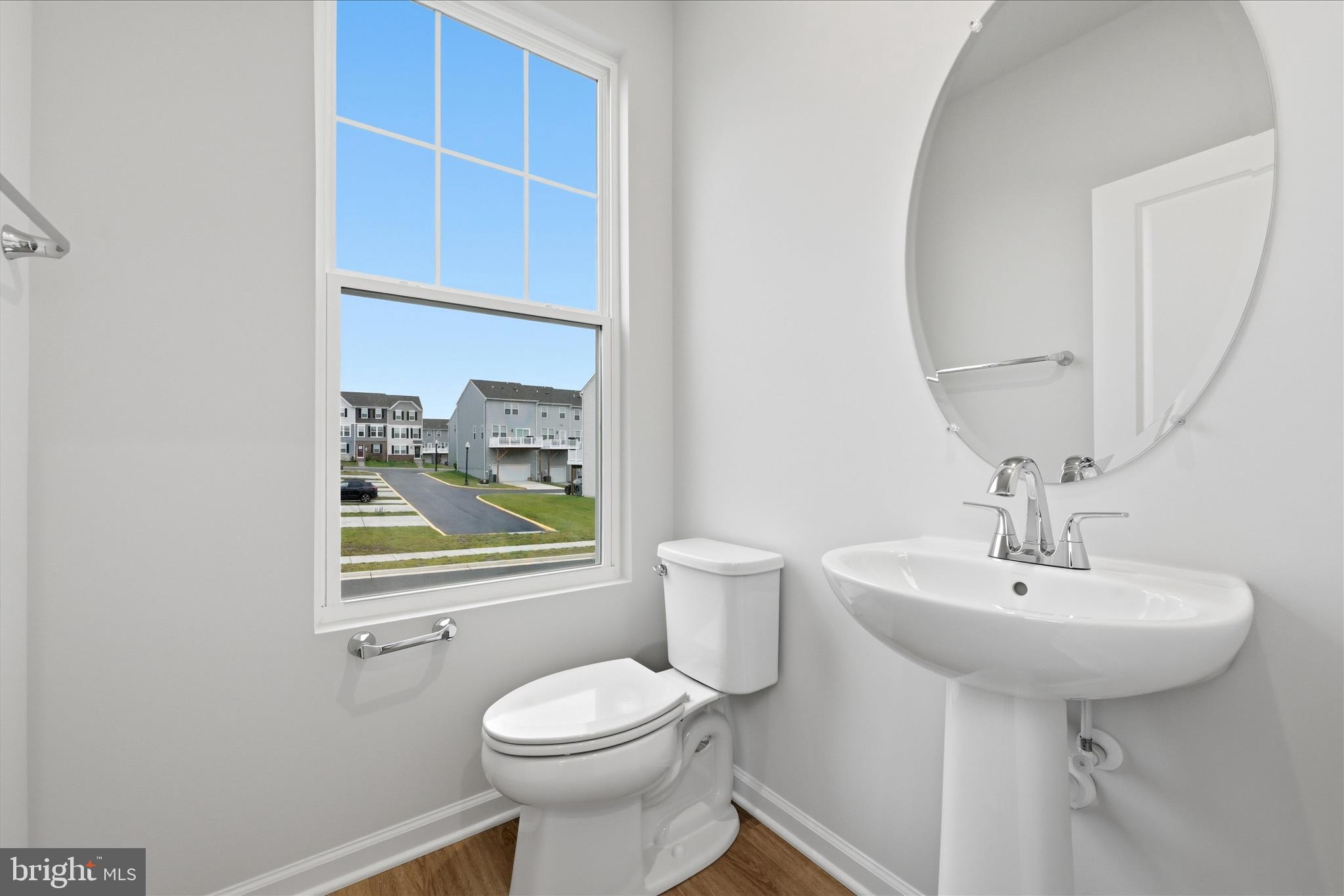 300 Presidents Pointe Avenue Ranson, WV 25438 - Photo 16 of 24 a bathroom with a sink a mirror and a toilet