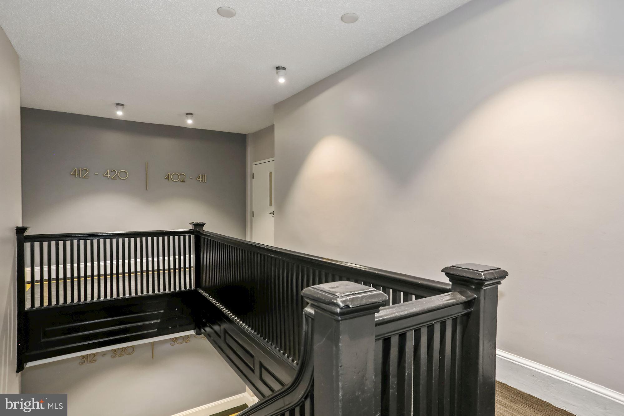 1401 Columbia Road Northwest, Unit 410 Washington, DC 20009 - Photo 33 of 37 Stairs and elevator