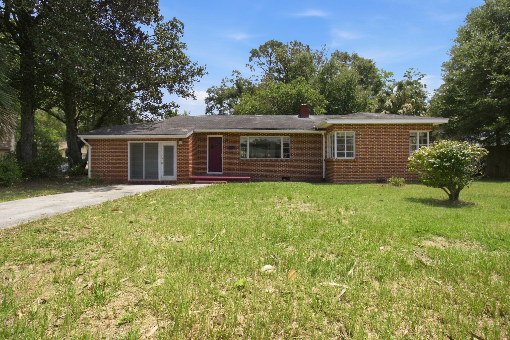 front view of a house with a yard