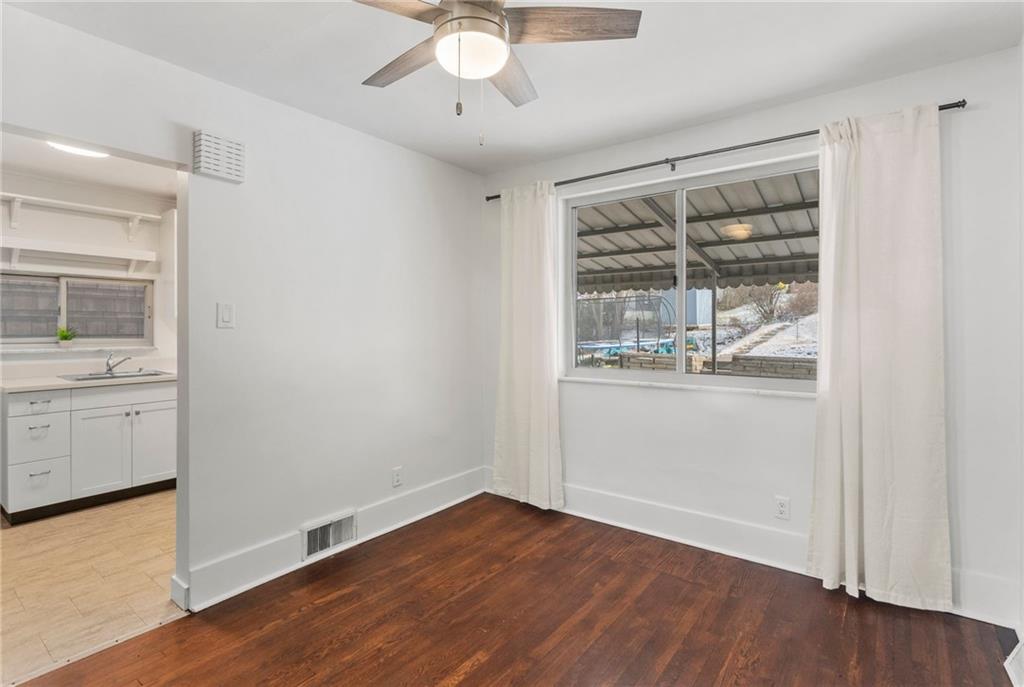 4227 Lydia Street Pittsburgh, PA 15207 - Photo 14 of 44 an empty room with wooden floor and windows