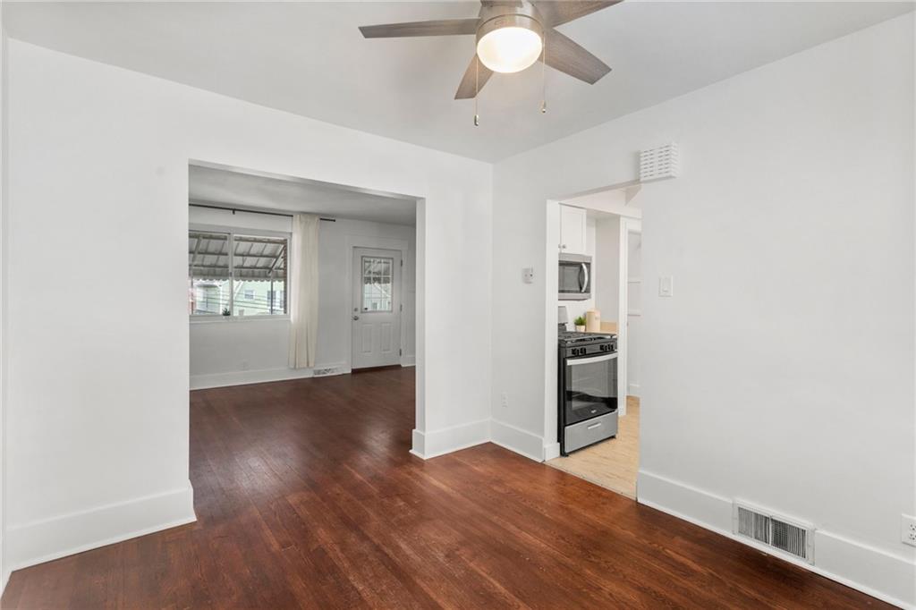 4227 Lydia Street Pittsburgh, PA 15207 - Photo 16 of 44 an empty room with wooden floor and windows