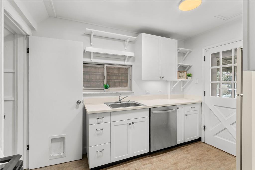4227 Lydia Street Pittsburgh, PA 15207 - Photo 17 of 44 a spacious bathroom with a granite countertop sink and a mirror