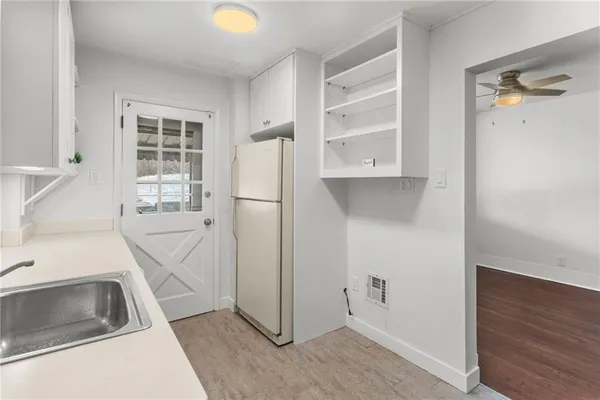 a kitchen with a sink and a cabinets