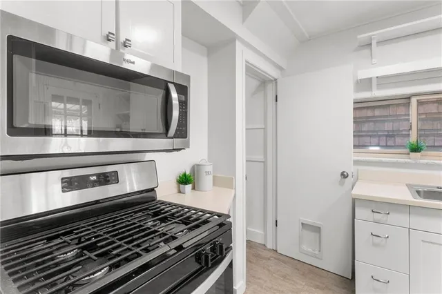 a view of an entryway with wooden floor