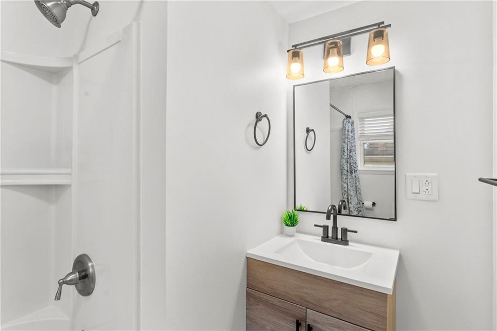 4227 Lydia Street Pittsburgh, PA 15207 - Photo 27 of 44 a bathroom with a sink and a mirror