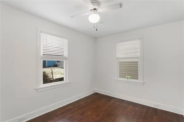 an empty room with wooden floor
