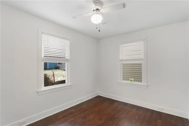 an empty room with wooden floor