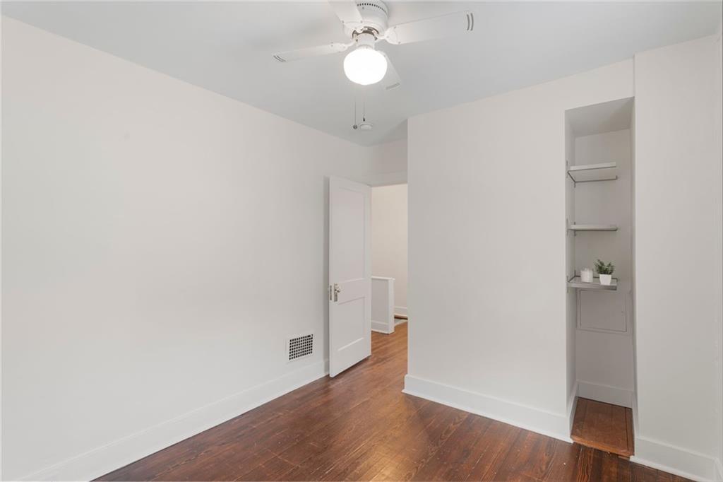 4227 Lydia Street Pittsburgh, PA 15207 - Photo 31 of 44 an empty room with wooden floor