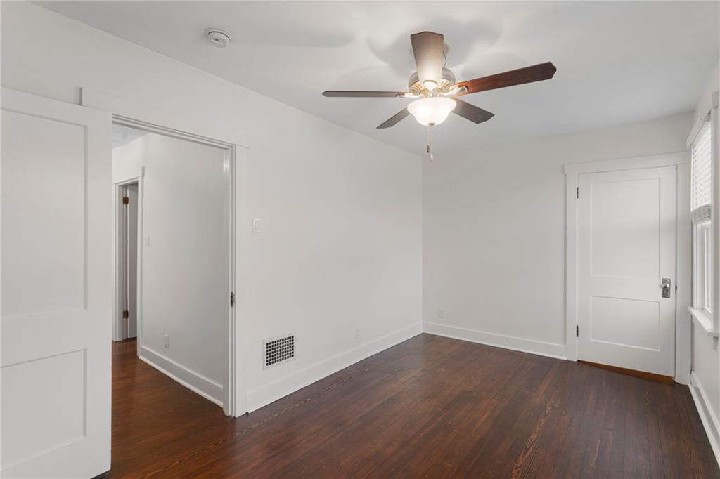 4227 Lydia Street Pittsburgh, PA 15207 - Photo 34 of 44 an empty room with wooden floor fan and windows
