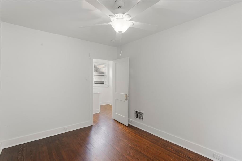 4227 Lydia Street Pittsburgh, PA 15207 - Photo 36 of 44 an empty room with wooden floor and a ceiling fan