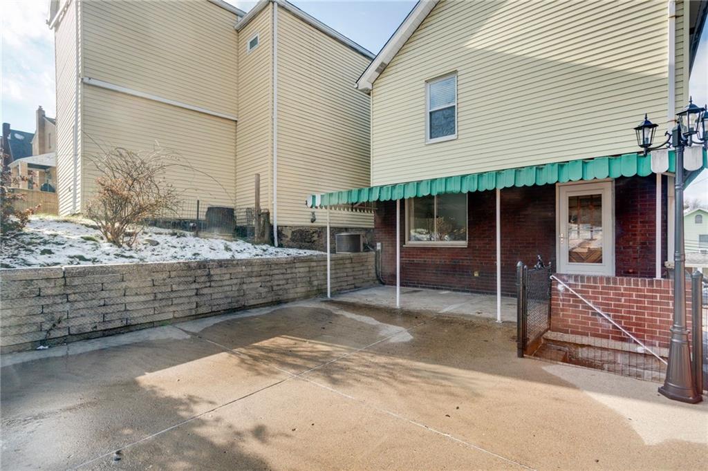 4227 Lydia Street Pittsburgh, PA 15207 - Photo 42 of 44 a view of a house with wooden fence