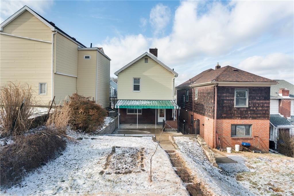 4227 Lydia Street Pittsburgh, PA 15207 - Photo 43 of 44 a front view of a house with garden