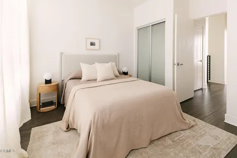a bedroom with a bed and a view of bathroom