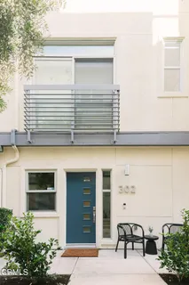 a view of house with outdoor space and seating area