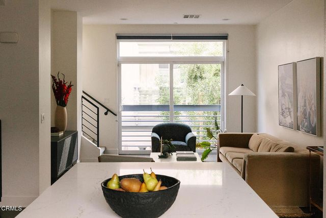 a living room with furniture and a large window