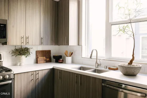 a kitchen with a sink and cabinets