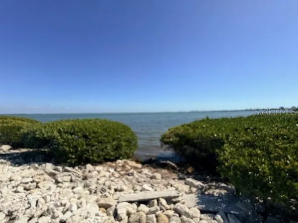 a view of a lake with a beach