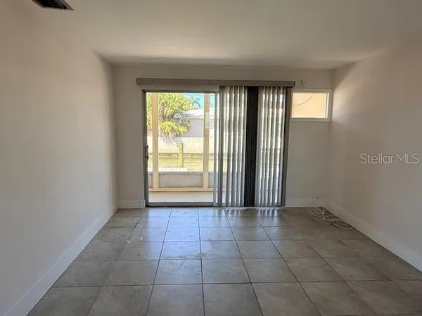 a view of an empty room and window