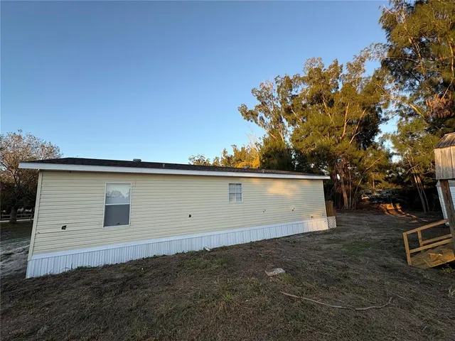 a view of an empty room with a storage