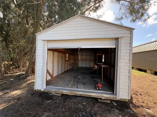 a view of a field with a tree