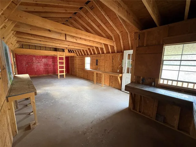 a view of a room with wooden floor and an entrance