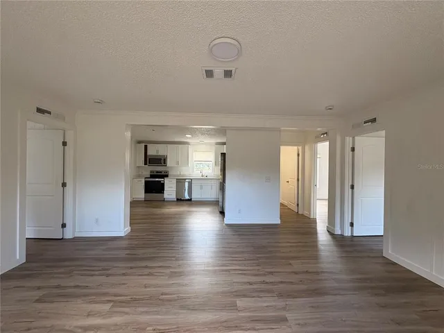 a view of a bathroom with wooden floor