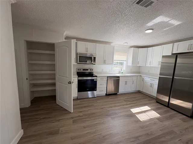 a bathroom with a sink toilet and vanity