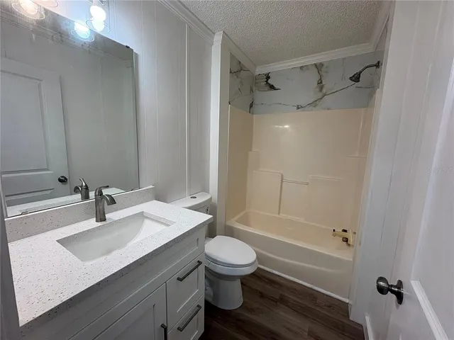 a bathroom with a bathtub and a sink