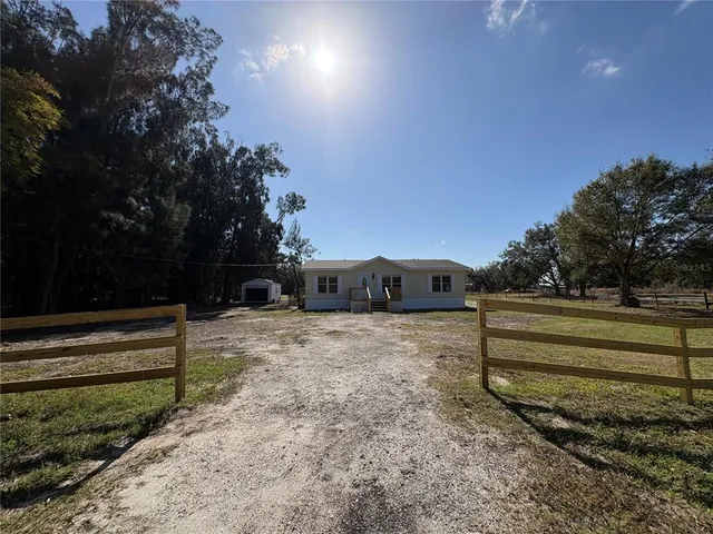 a view of a backyard of the house