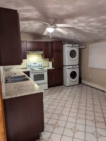 a kitchen with a stove and a refrigerator