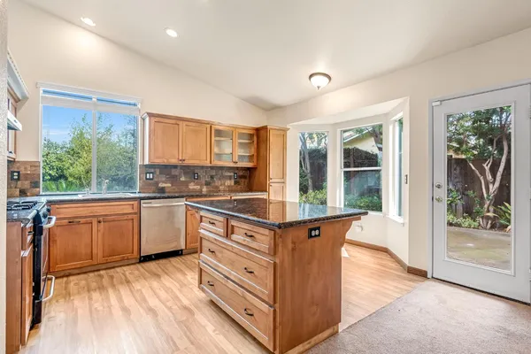 a view of a livingroom with a furniture and a ceiling fan