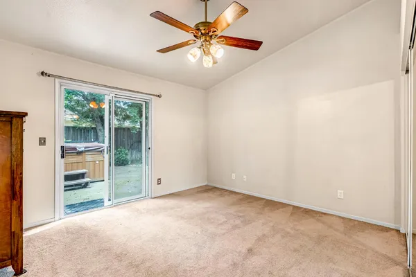 a view of a backyard with sitting area