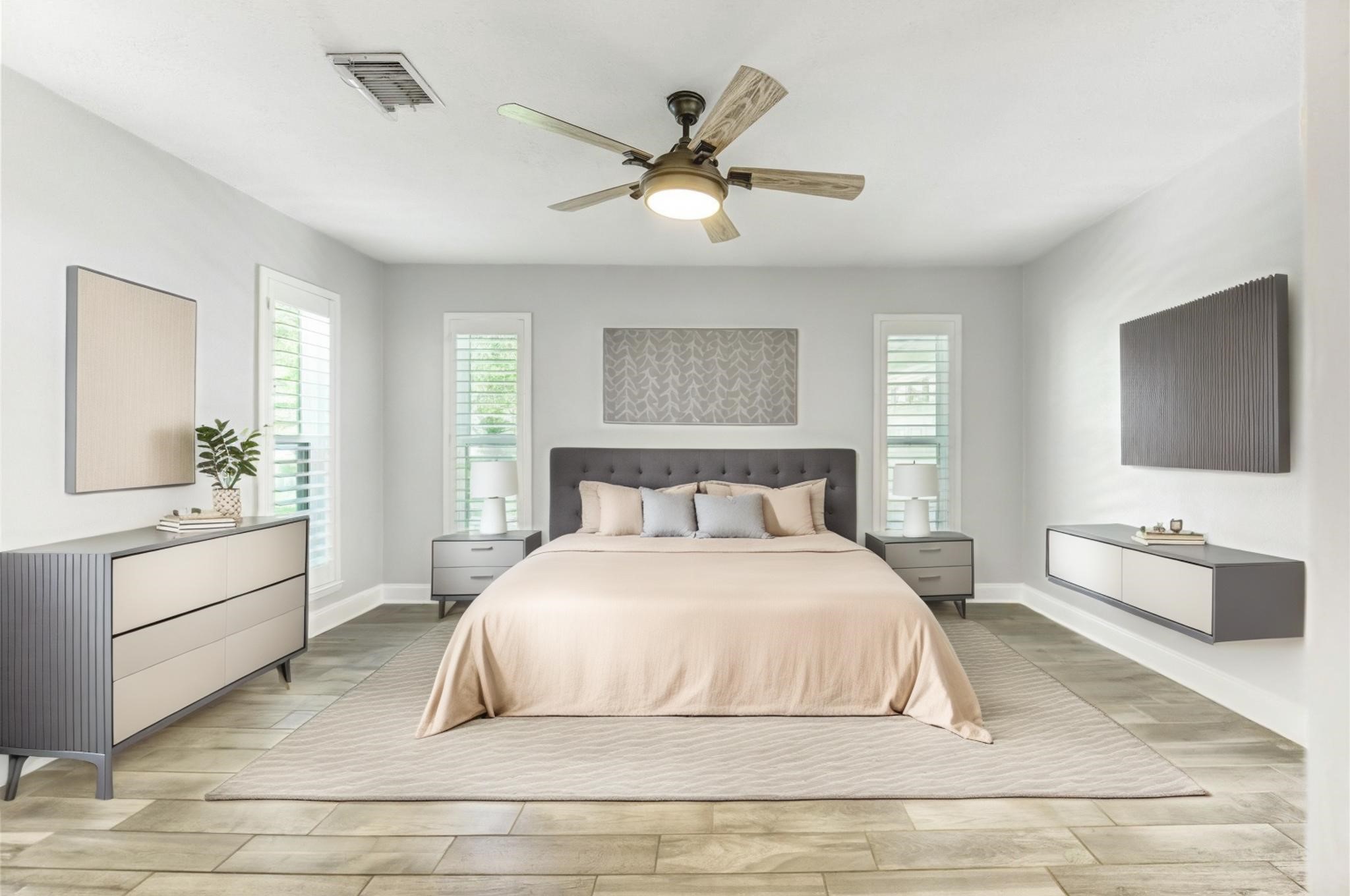 1904 Nursery Road The Woodlands, TX 77380 - Photo 17 of 43 a bedroom with a large bed and a chandelier