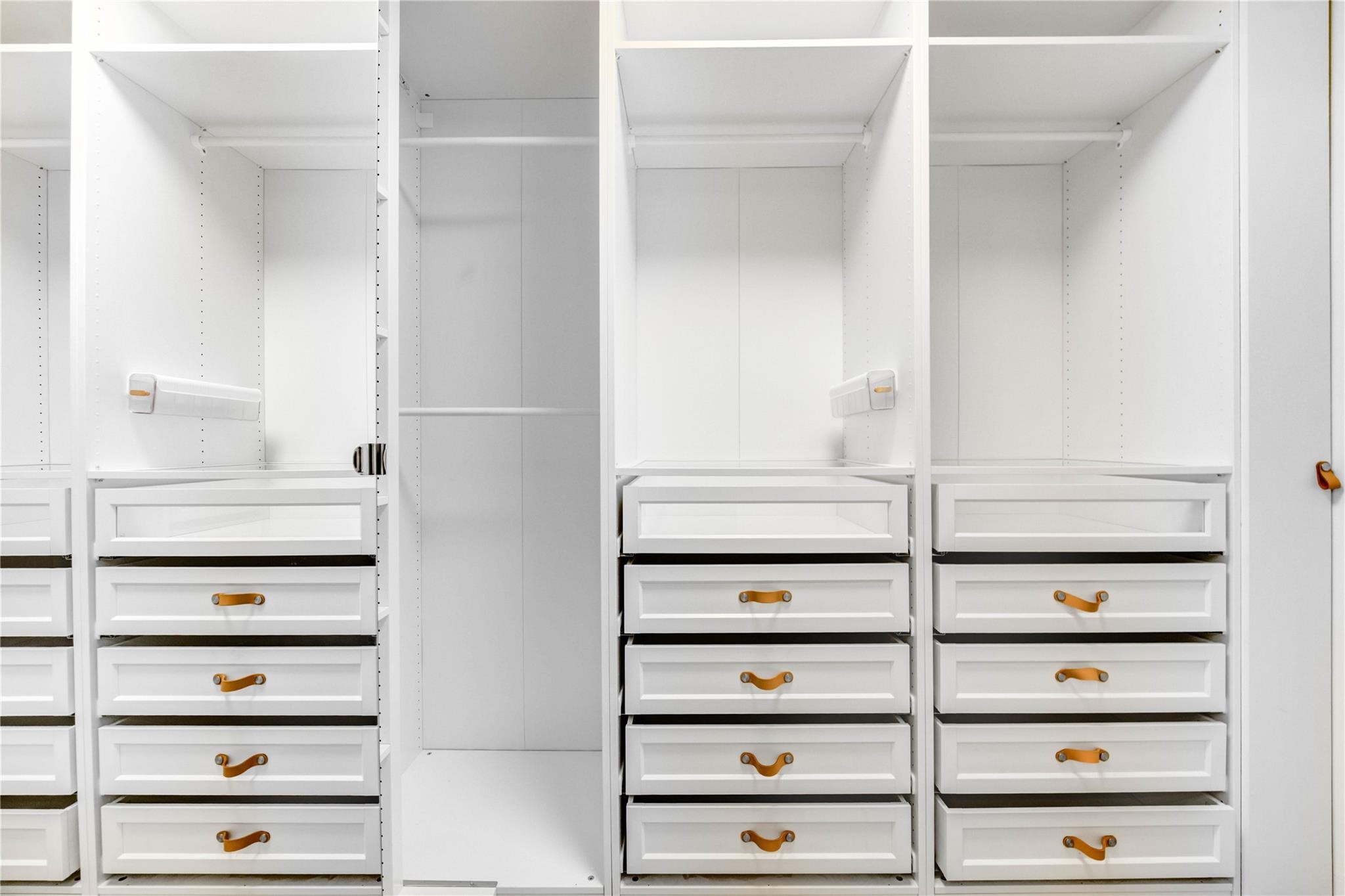 1904 Nursery Road The Woodlands, TX 77380 - Photo 24 of 43 a view of walk in closet with empty racks