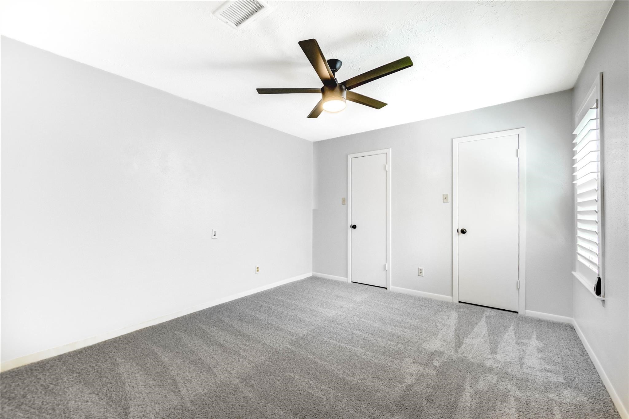 1904 Nursery Road The Woodlands, TX 77380 - Photo 27 of 43 a view of a livingroom with a ceiling fan and window