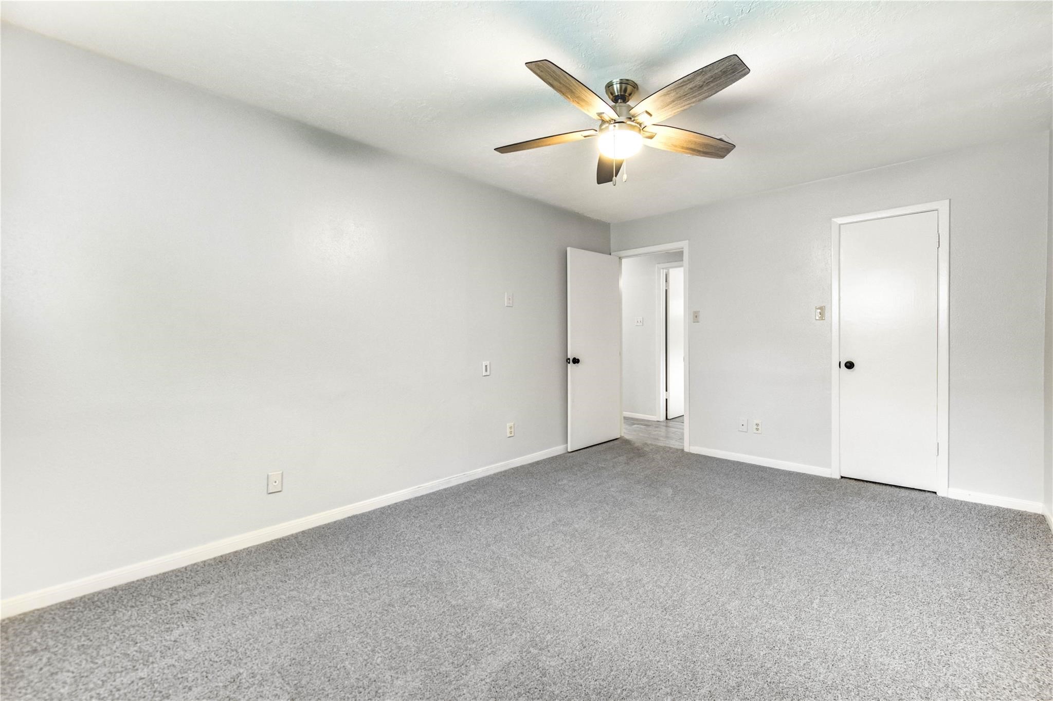 1904 Nursery Road The Woodlands, TX 77380 - Photo 33 of 43 an empty room with closet and ceiling fan