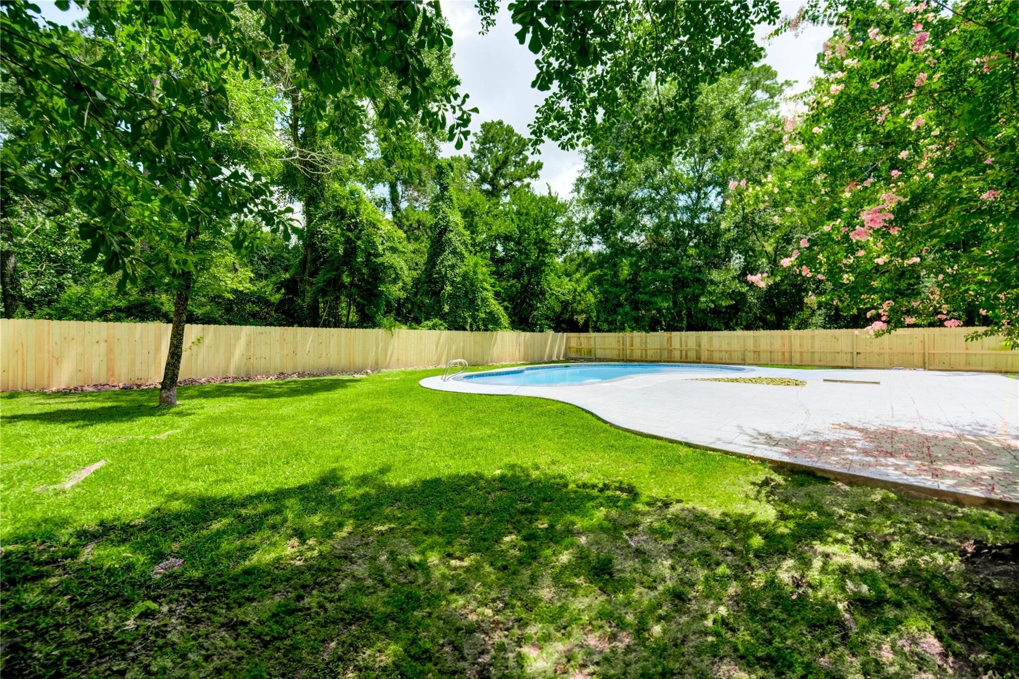 1904 Nursery Road The Woodlands, TX 77380 - Photo 37 of 43 a view of swimming pool with a yard