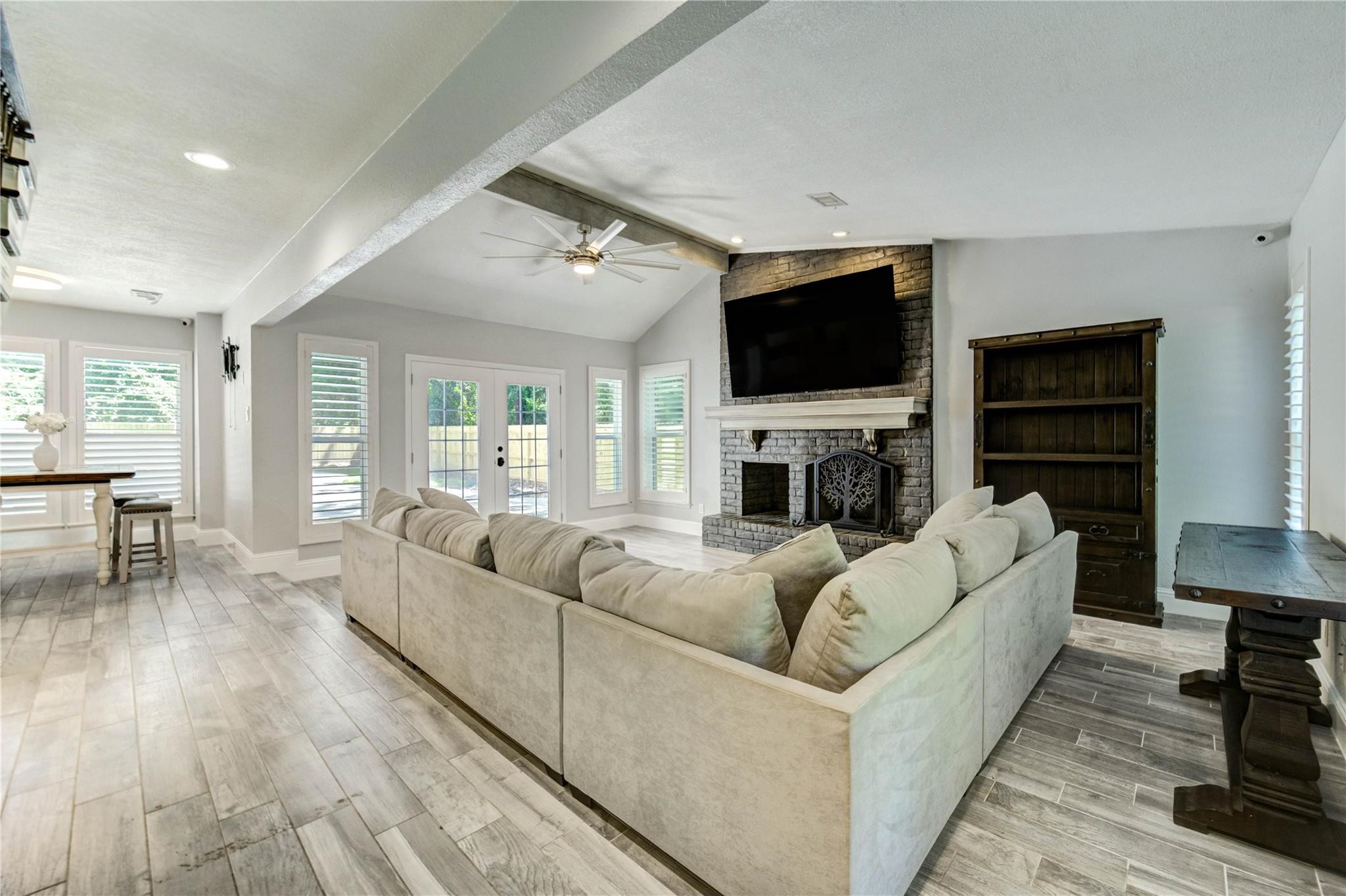1904 Nursery Road The Woodlands, TX 77380 - Photo 4 of 43 a living room with fireplace furniture and a flat screen tv