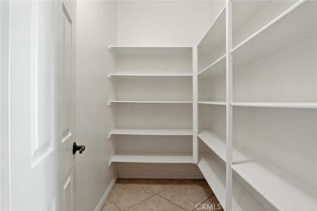 18338 Lakepointe Drive Riverside, CA 92503 - Photo 27 of 40 a view of a room with shelves